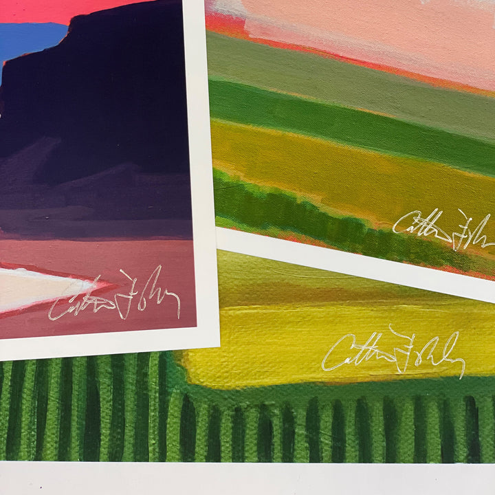 Close-up of signed fine art prints with detail and texture.